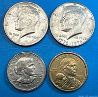 Front view of all four coins: 1971 and 1776-1976 Kennedy halves, 1979 SBA dollar, 2000-D Sacagawea dollar