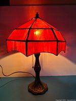 Lamp illuminated showing full shade and base