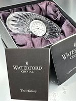 Clock in presentation box with booklets visible