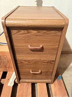 Front view of brown oak laminate 2-drawer filing cabinet
