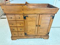 Front view of dry sink showing drawers, doors, hardware