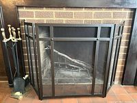 Front view of fireplace screen and tool set