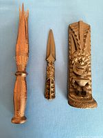 overview of all three carved wooden items