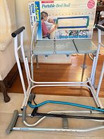 Lot overview with transfer bench, boxed bed rail, crutch and cane