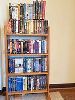 Full view of four-tier wooden rack holding entire media lot