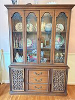 Full view of oak china cabinet hutch showing glass upper display and lower drawers