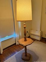 Full view of oak floor lamp showing table shelf and shade