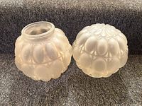 pair of frosted glass globes front view