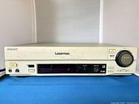 Front view of Sony Lasermax MDP-1100 showing full faceplate, display, buttons and play knob