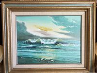 Full view of framed seascape painting