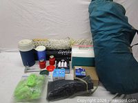 Group shot of all items including tent bag, cooler, hammock bag, filters and accessories