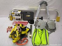 Group shot of all items including harness, vest, ladder standoff, roofing pads, boxed cleats, case and accessories