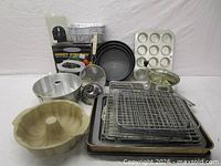 Group shot of all bakeware including pans, racks, sheets, strainers