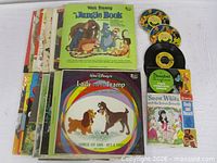 Stack of Disney LPs, Snow White book-and-record, three 7" picture discs and one 45 RPM single