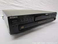 Front angled view showing Sony branding, power button, tray and controls