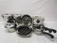 Full cookware set arranged to show variety of pieces