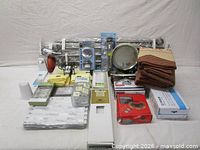 Group shot of all items including curtain panels, rods, tile packs, hooks, and hardware