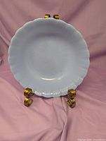 Front view of pastel blue milk glass bowl on stand