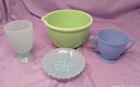 Group shot of all four coloured glass items