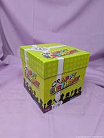 Front angle of lime-green Crappy Birthday cube box