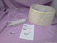 Lamp shade, battery pack with cable, instruction booklet
