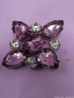 Front view showing five purple marquise rhinestones and four clear round rhinestones