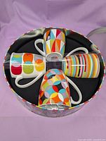 Top view of four mugs in gift tin