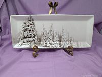 Front view of Pier 1 Winter Forest platter on stand