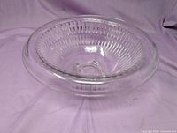 Top angled view of the clear ribbed glass bowl