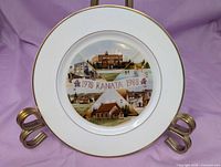 Front view of plate showing design and gilt rim