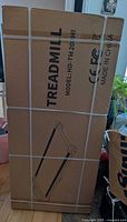 Sealed shipping carton labelled TREADMILL model HD-TM20MI