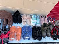 All footwear pairs displayed on table