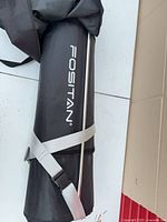 FOSITAN branded cylindrical carry bag with strap