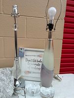 Overall shot of both lamps, wall art, glass heart dishes