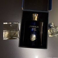 All three perfume bottles shown with Tequila Bleu in box centered, Michael Kors and Burberry at sides