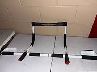 Front view of Perfect Multi-Gym pull up bar on table