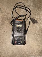 Top view showing full charger, attached cord and indicators