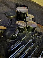 Full view of drums, throne and hardware on ground
