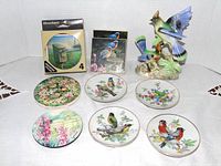 Group view of figurine, plates and coasters
