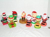 Group shot of nine solar figures front view