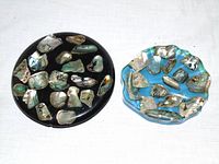 Black trivet and turquoise dish side by side