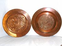 Front view showing both copper plaques and relief designs