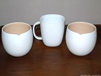 Front view of two India Mahdavi cups and Federica Bias mug