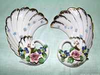 Pair of matching porcelain swan wall pockets front view