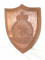 Front view of carved wooden RCAF 433 Squadron shield plaque