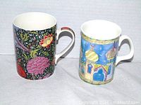 Front view of both mugs showing patterns