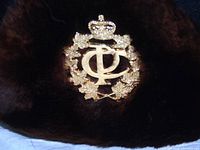 Front view showing badge and fur trim