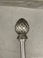 close-up of decorative finial on rod end