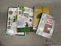 All four books laid out showing covers