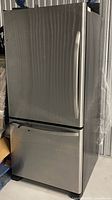 Front view of stainless steel Whirlpool bottom-freezer refrigerator